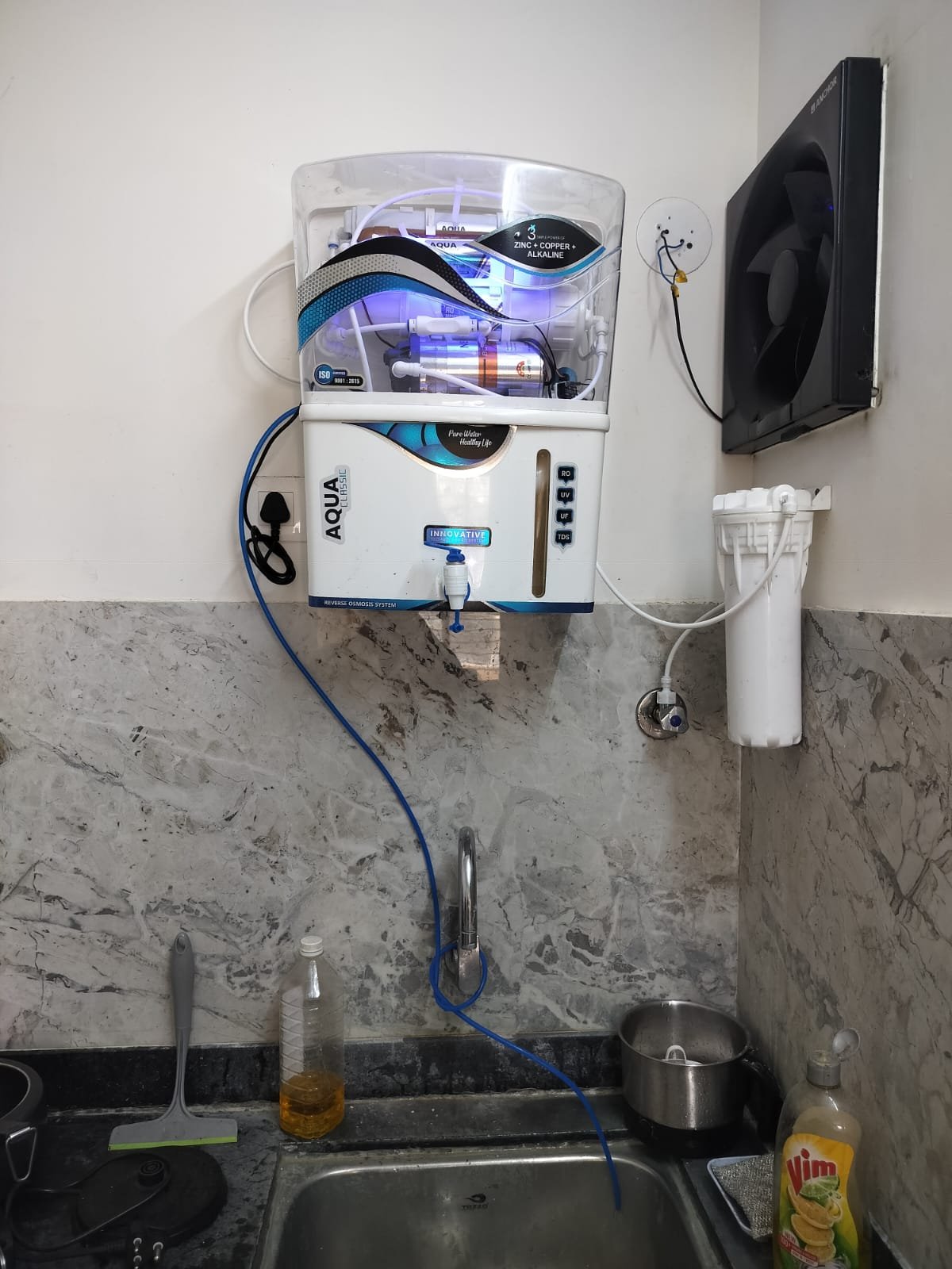 Water purifier installed in a kitchen